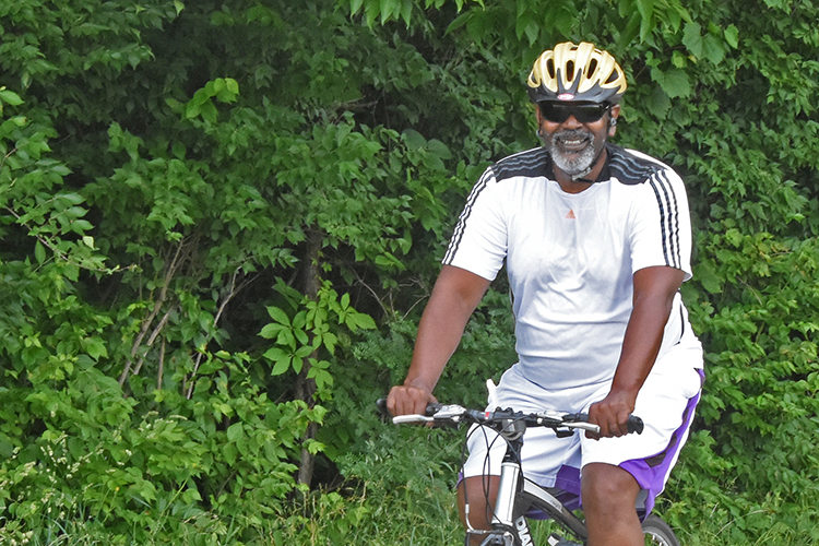 Biker smiling on Blacklick Greenway at Three Creeks Metro Park