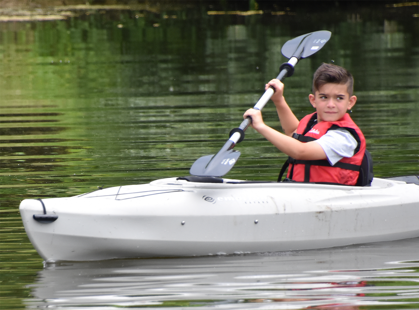 Kayaker on the Dragonfly Day Camp pond at Highbanks.