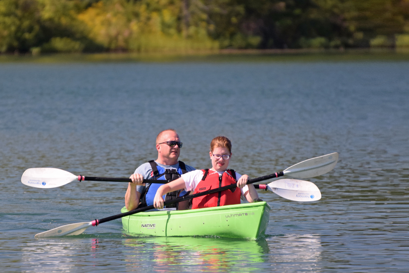 Canoeists on lake for an Outdoor Adaptive Adventures program at Prairie Oaks.