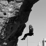 Climber repels down the climbing wall at Scioto Audubon