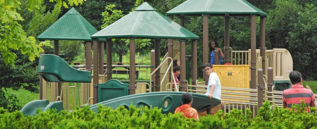 Kids on the play equipment at Homestead Metro Park