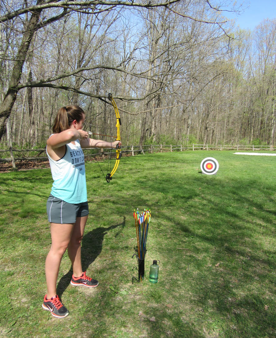 Woman shoots an arrow on an archery program at Blendon Woods