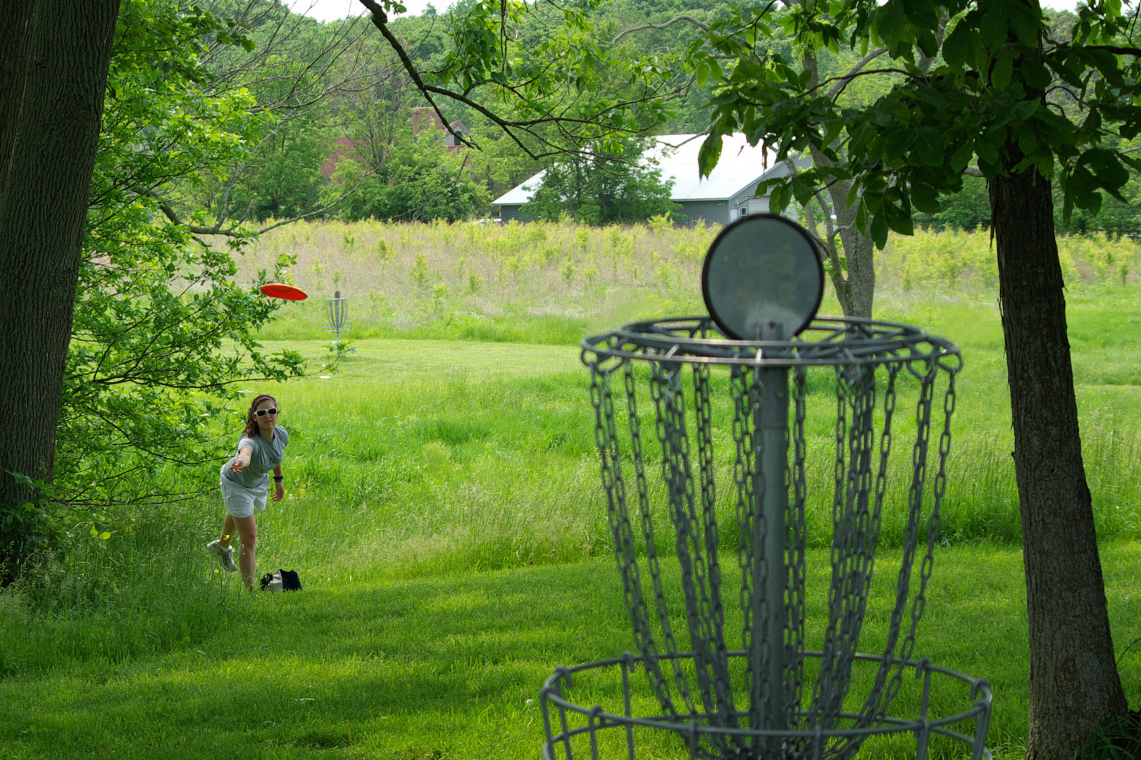 A player on the disc golf course at Glacier Ridge