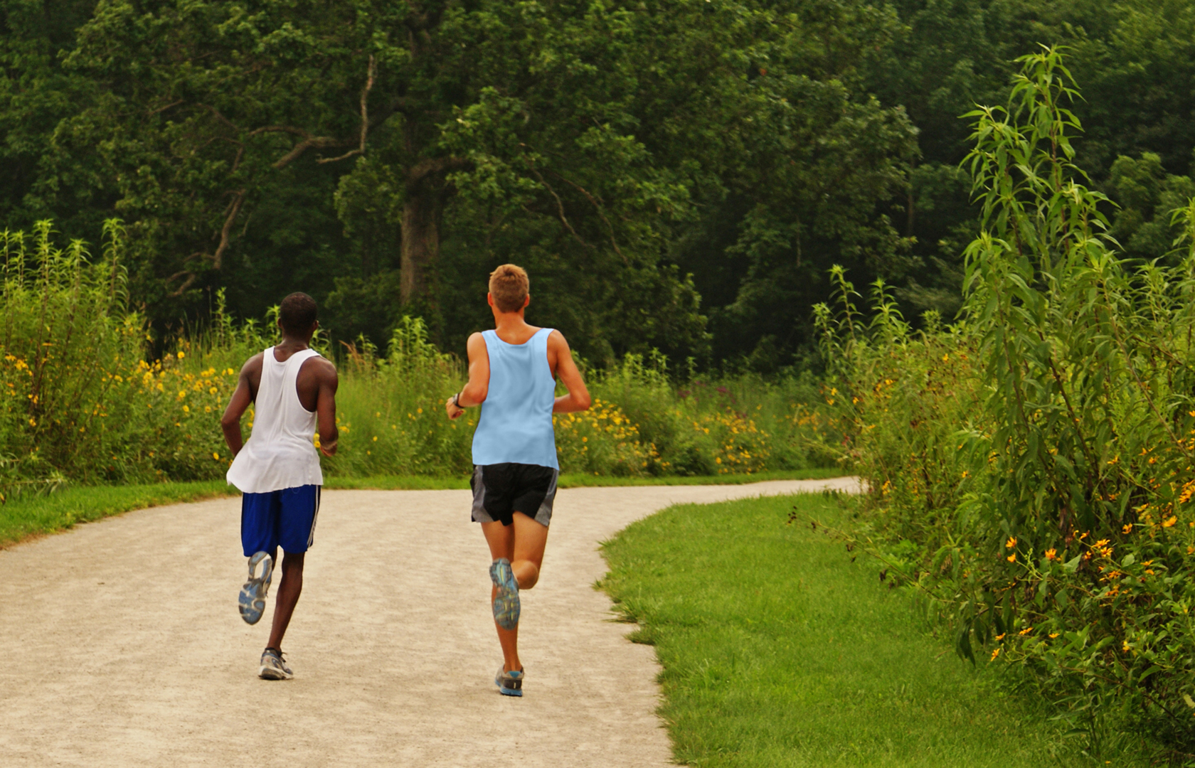 Two boys jogging on Darby Creek Greenway Trail at Battelle Darby Creek Metro Park