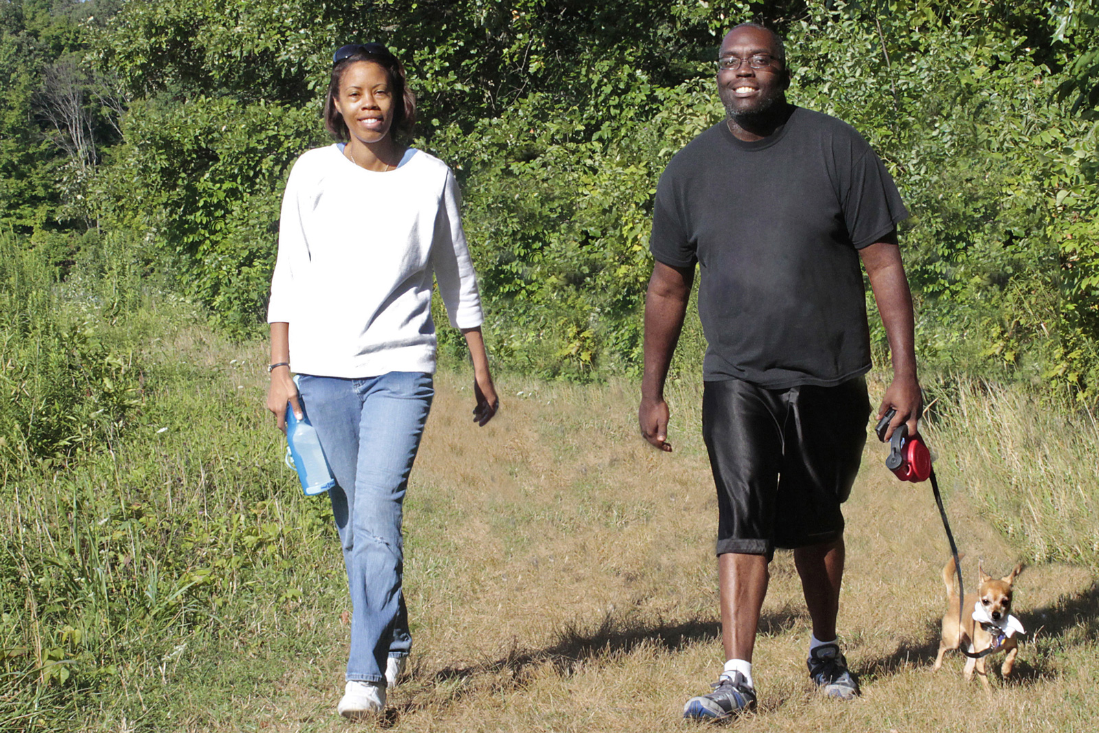 Doggies and handlers take a walk on the Sugarbush Trail at Blendon Woods during the Paws in the Park event