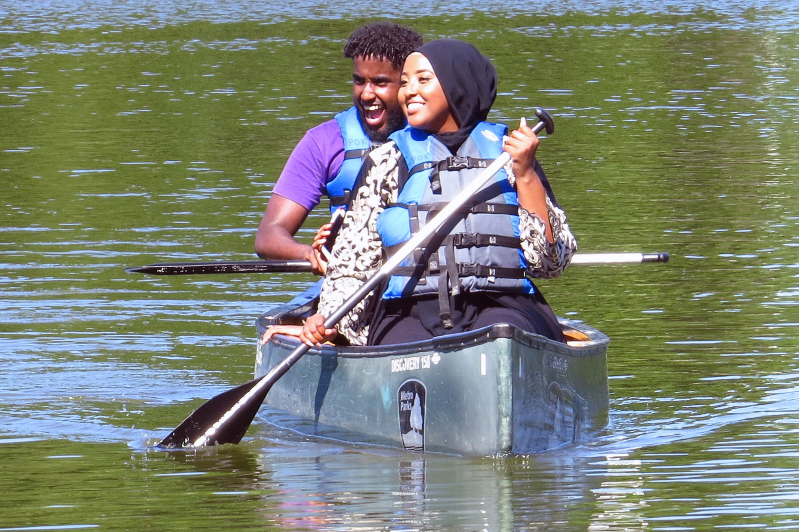 Two people paddle on Schrock Lake at Sharon Woods.