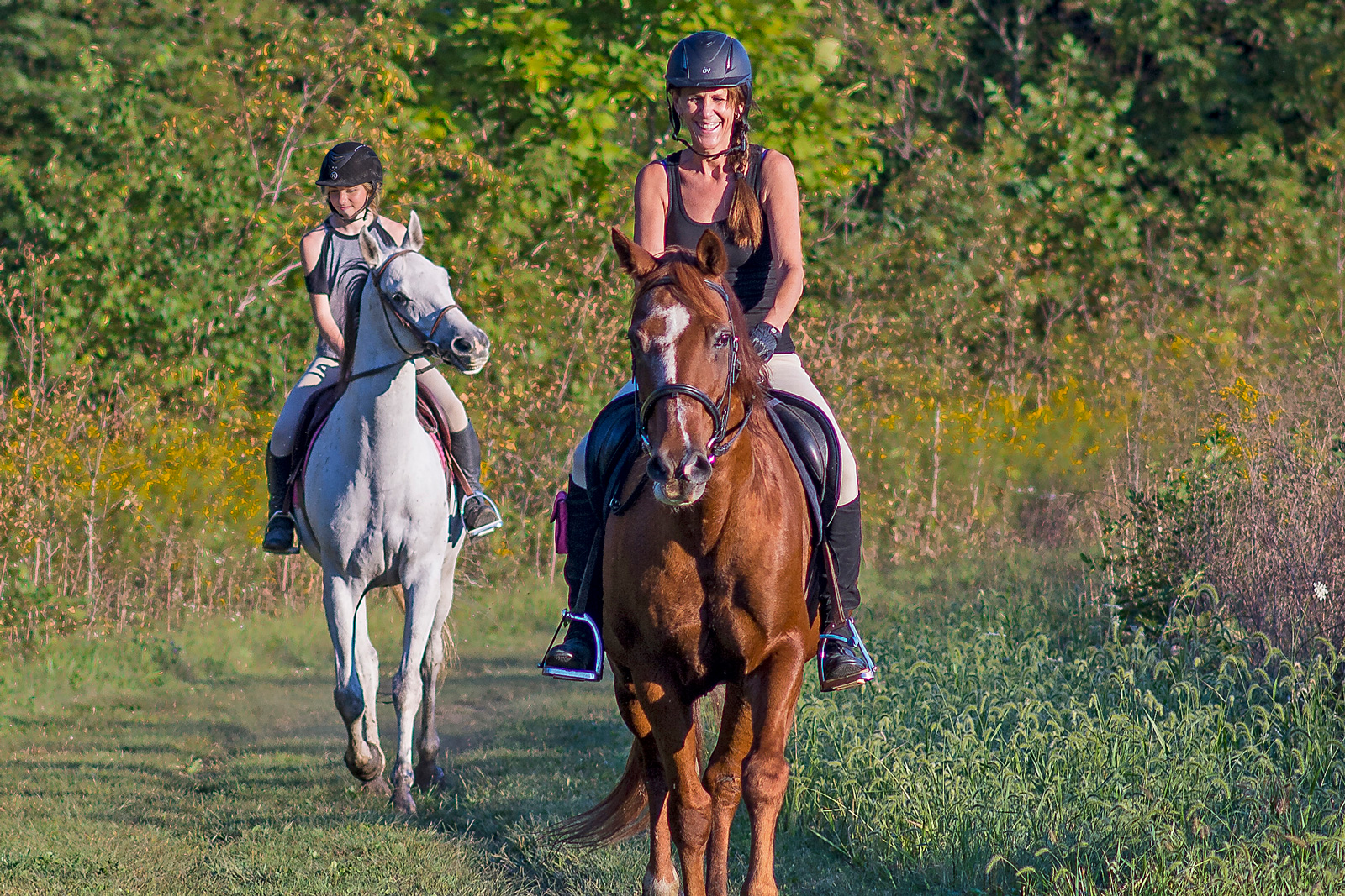 Mother and daughter riding on Bridle Trail at Prairie Oaks.