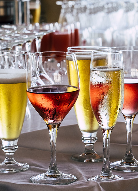 Set of coloured glasses at the restaurant with wines and beer.