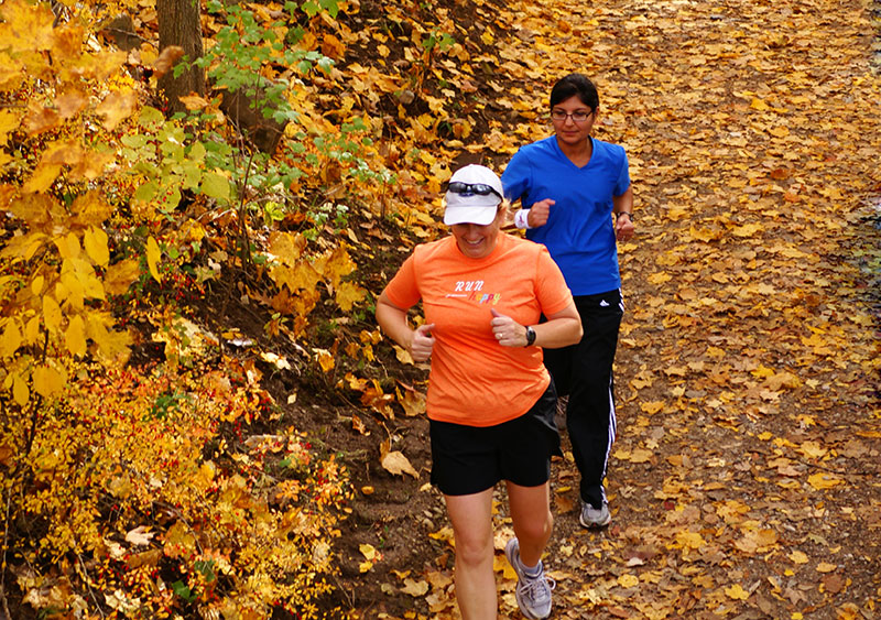 Joggers on the Dripping Rock Trail during the Commit To Be Fit hike at Highbanks