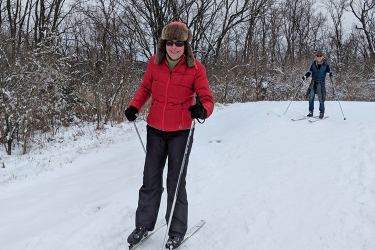 A woman cross country skis on the Darby Creek Greenway Trail at Prairie Oaks Metro Park