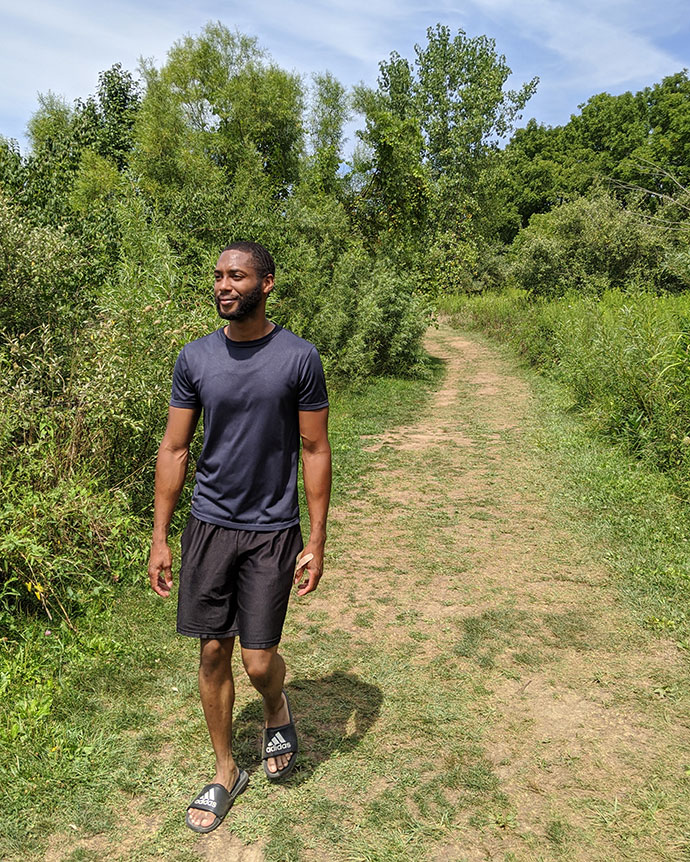 Man walks on the Lake View Trail at Prairie Oaks