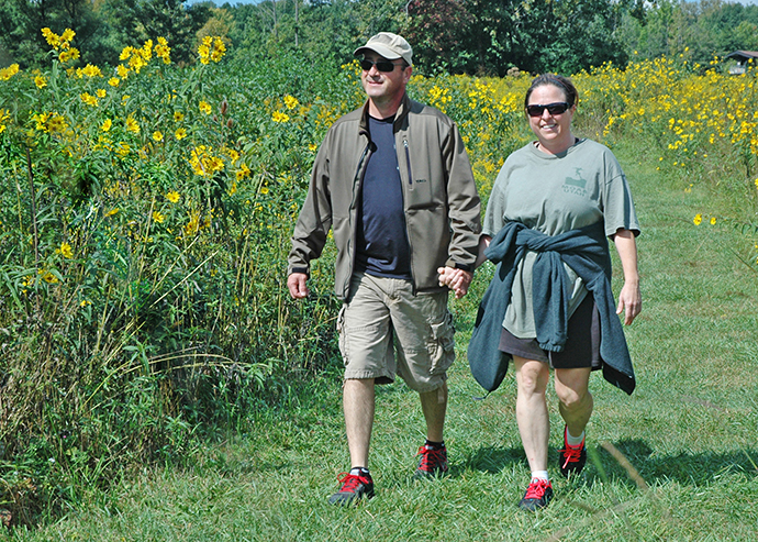 Couple on prairie connector trail at Sharon Woods Metro Park