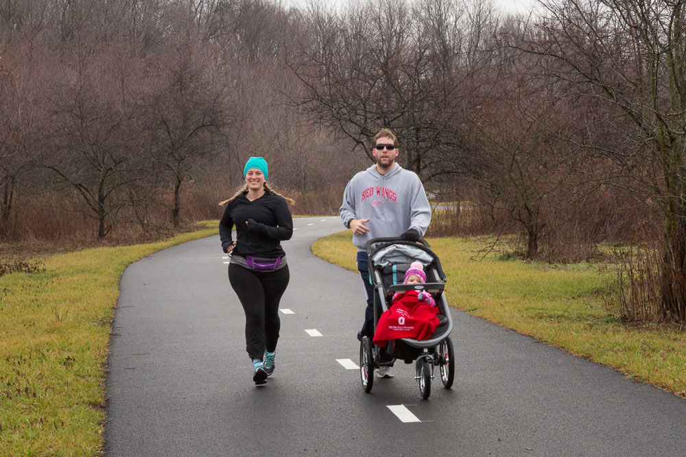 Joggers with stroller on the Beech Woodland Trail at Rocky Fork.