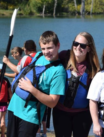 Two young adults one male and one female participating in adaptive programing at metro parks