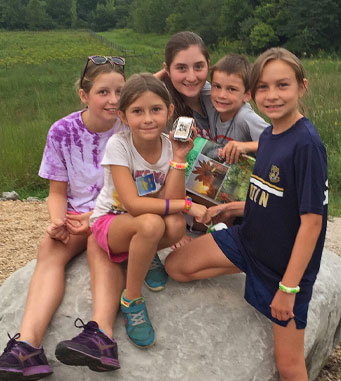 Group of kids geocaching in Metro Parks